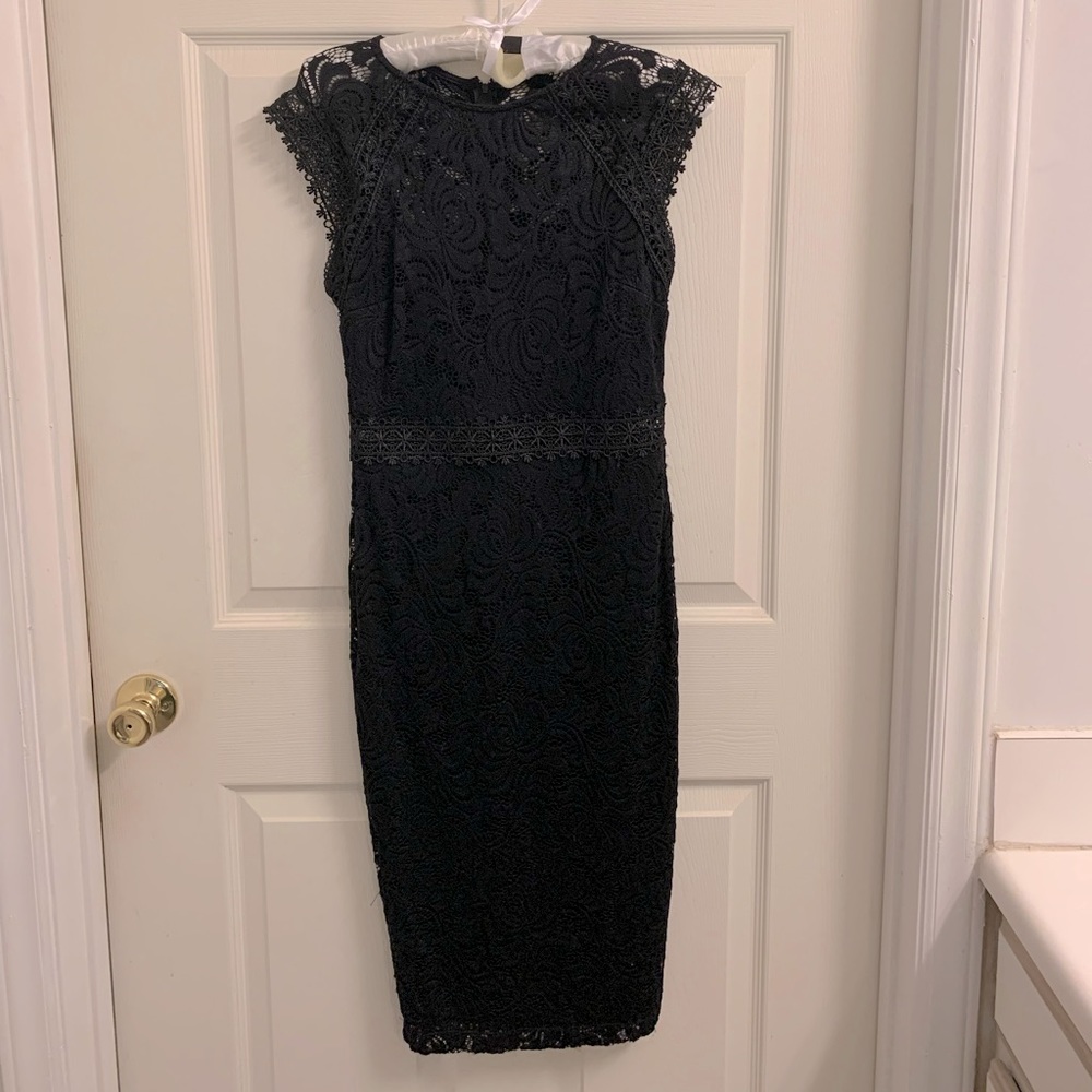 Black cocktail dress by Bisou Bisou.